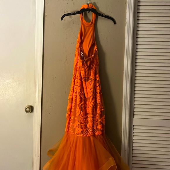Selling an orange mermaid prom dress, size 4, wore one time in great condition. - Picture 2 of 2